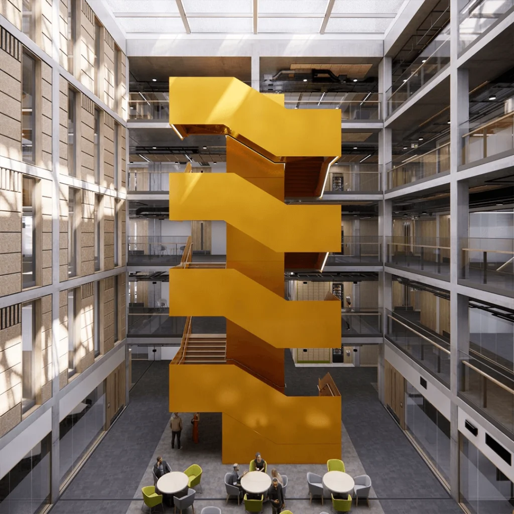A large, bright yellow zigzag staircase stands as a striking structural feature in the centre of a modern atrium with glass walls and several floors of open walkways.